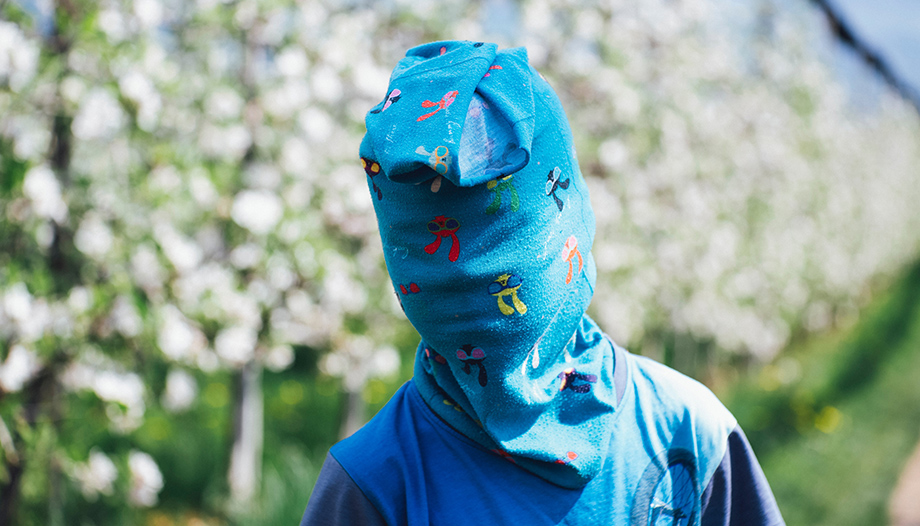 boy with his face covered